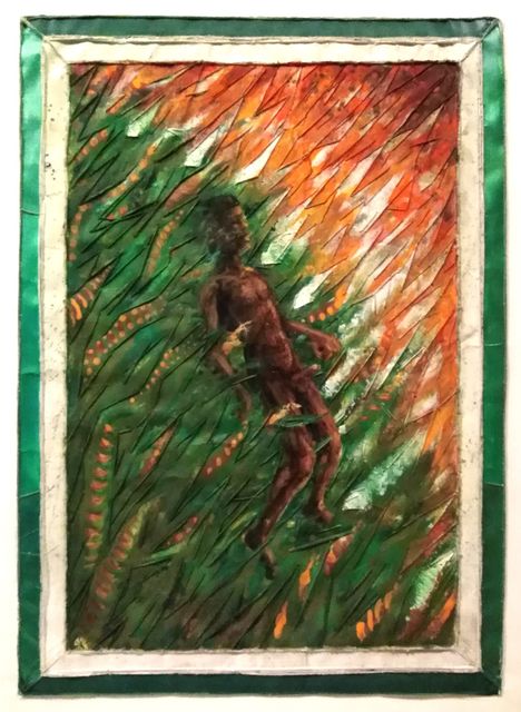 A slender brown figure climbs through a dense field of green blade-like leaves and orange-red flames, bordered in green and cream fabric.