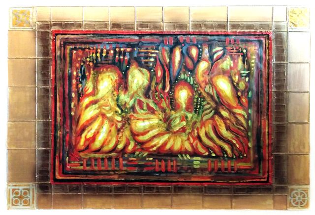 An abstract relief of swirling flame-like forms in golden yellow, red and green, surrounded by a broad hand-painted tan tile border.